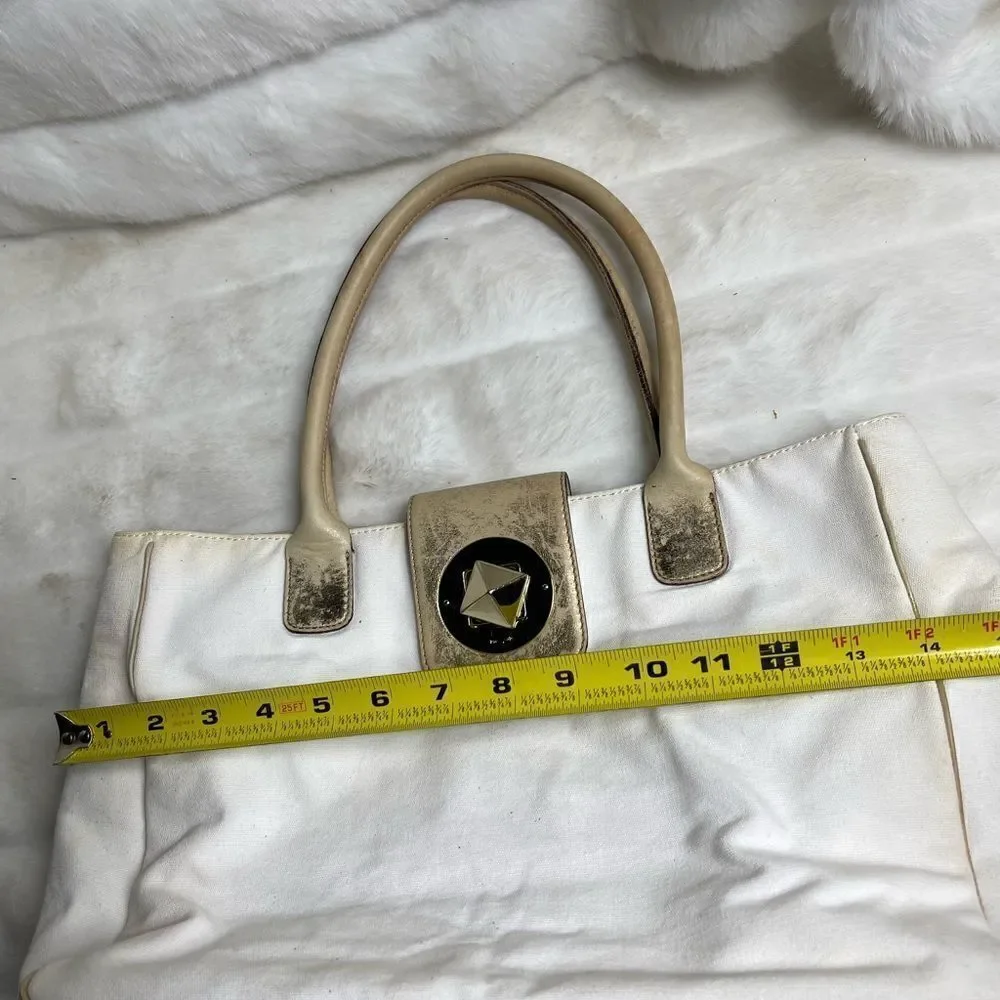 Vintage Kate spade beige canvas and faded gold trims shoulder bag.